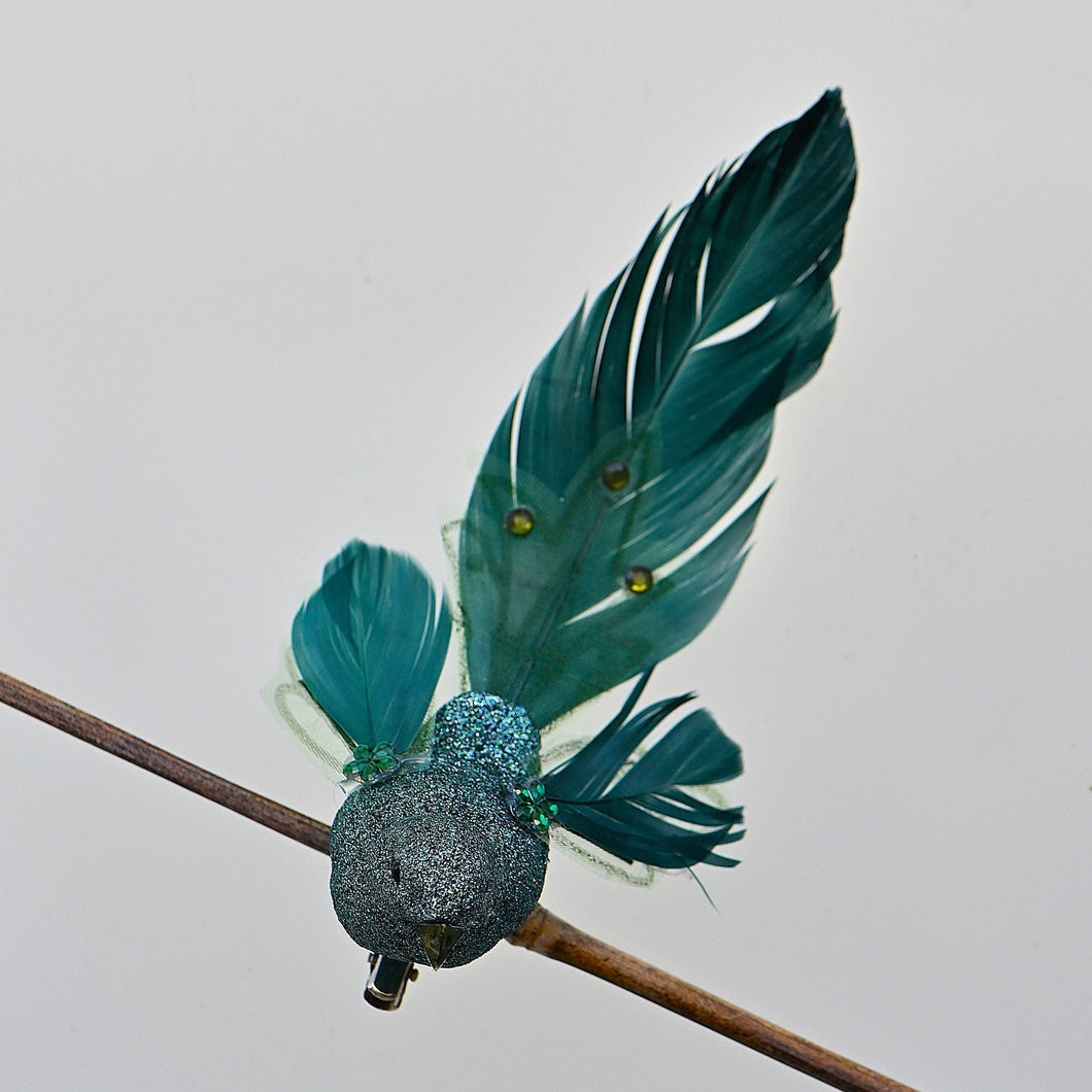 Exotischer Vogel auf Clip, geradeaus schauend Weihnachtsbaumschmuck Kunsthandel Rueckeshaeuser