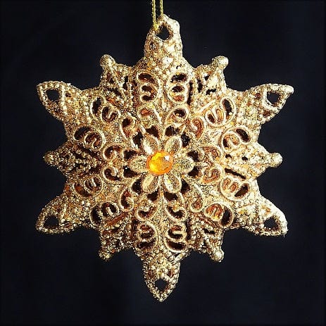Goldene Schneeflocke mit filigranem Muster und gelbem Schmuckstein Weihnachtsbaumschmuck Kunsthandel Rueckeshaeuser